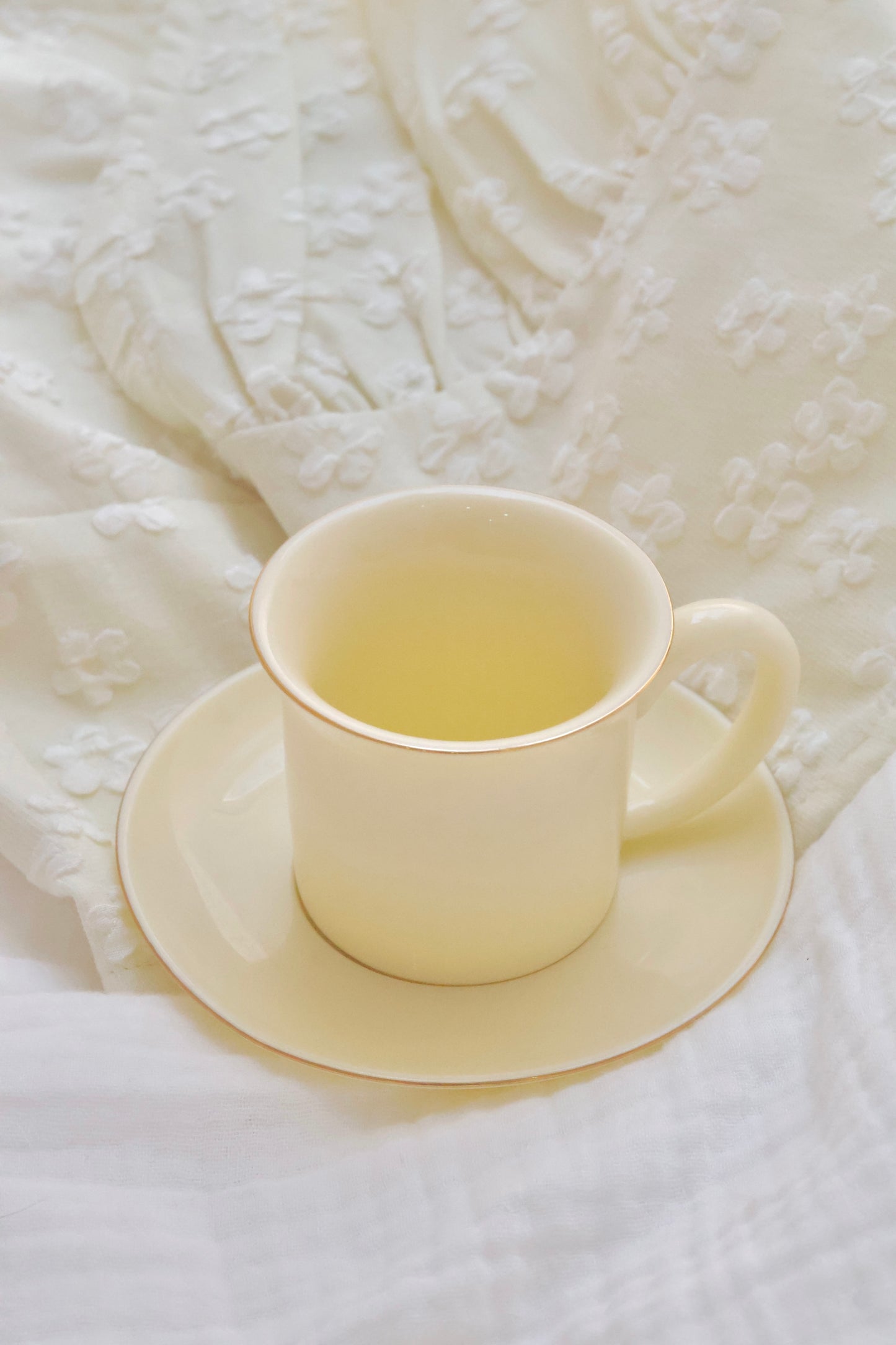 Porcelain expresso cup and saucer in lemon yellow