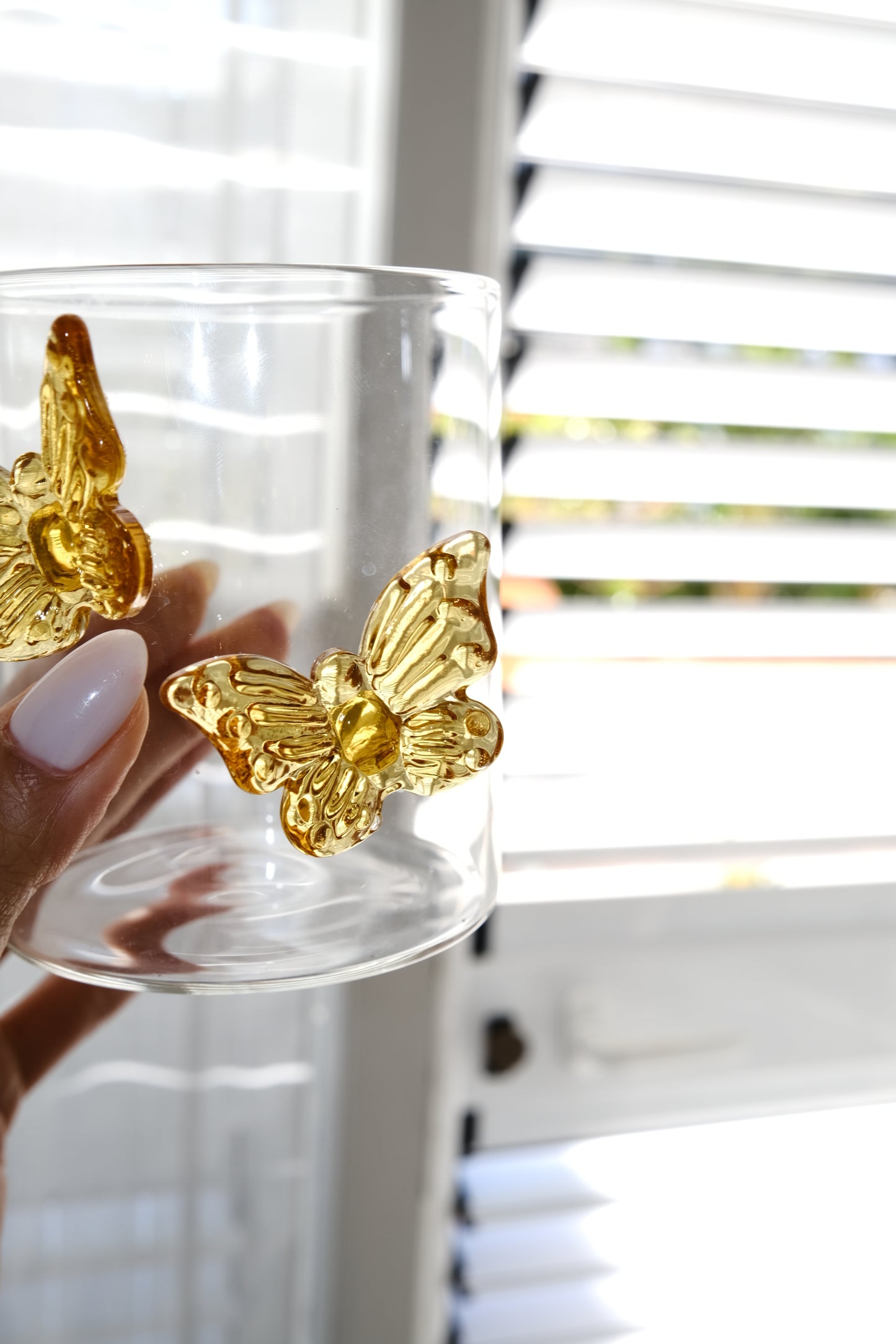 Butterfly dream glass tumbler in twilight gold