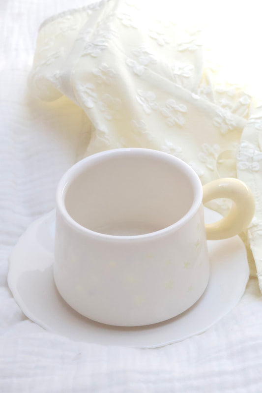 Creamy yellow star decor aesthetic coffee and saucer