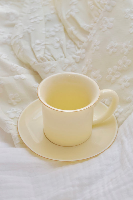 Porcelain expresso cup and saucer in lemon yellow