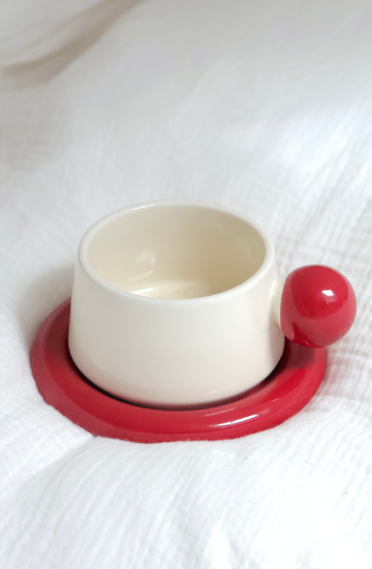 Donut shaped coffee cup in cherry red